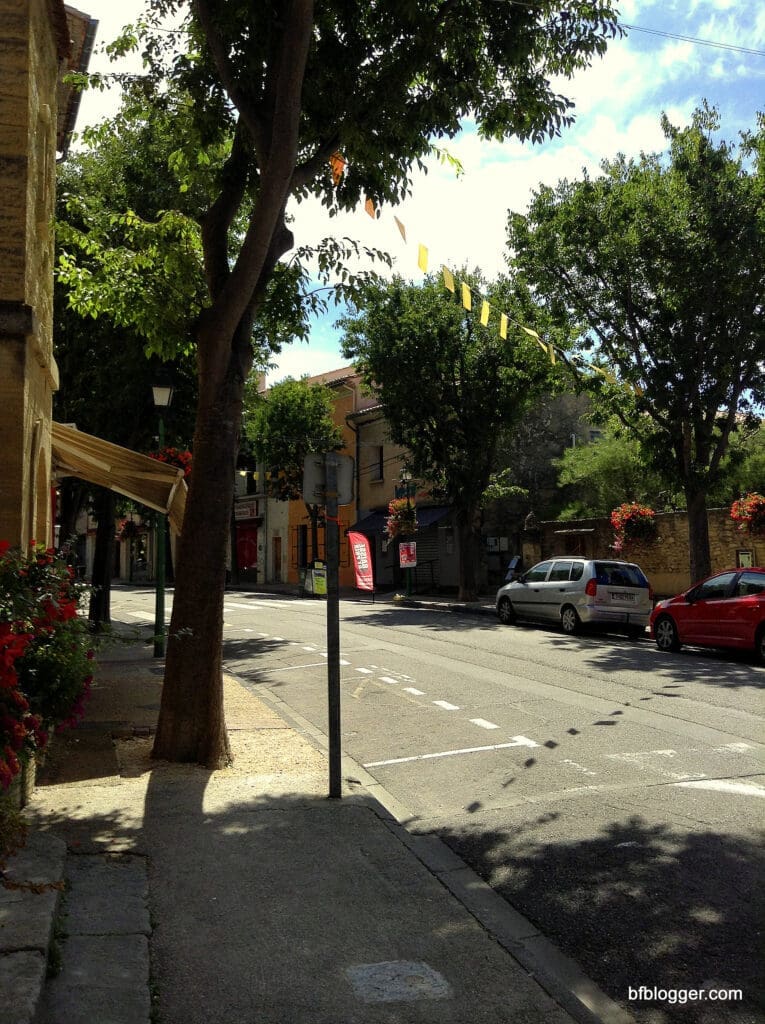 Main street in Caromb is like a modern city with ancient buildings in between the new. 