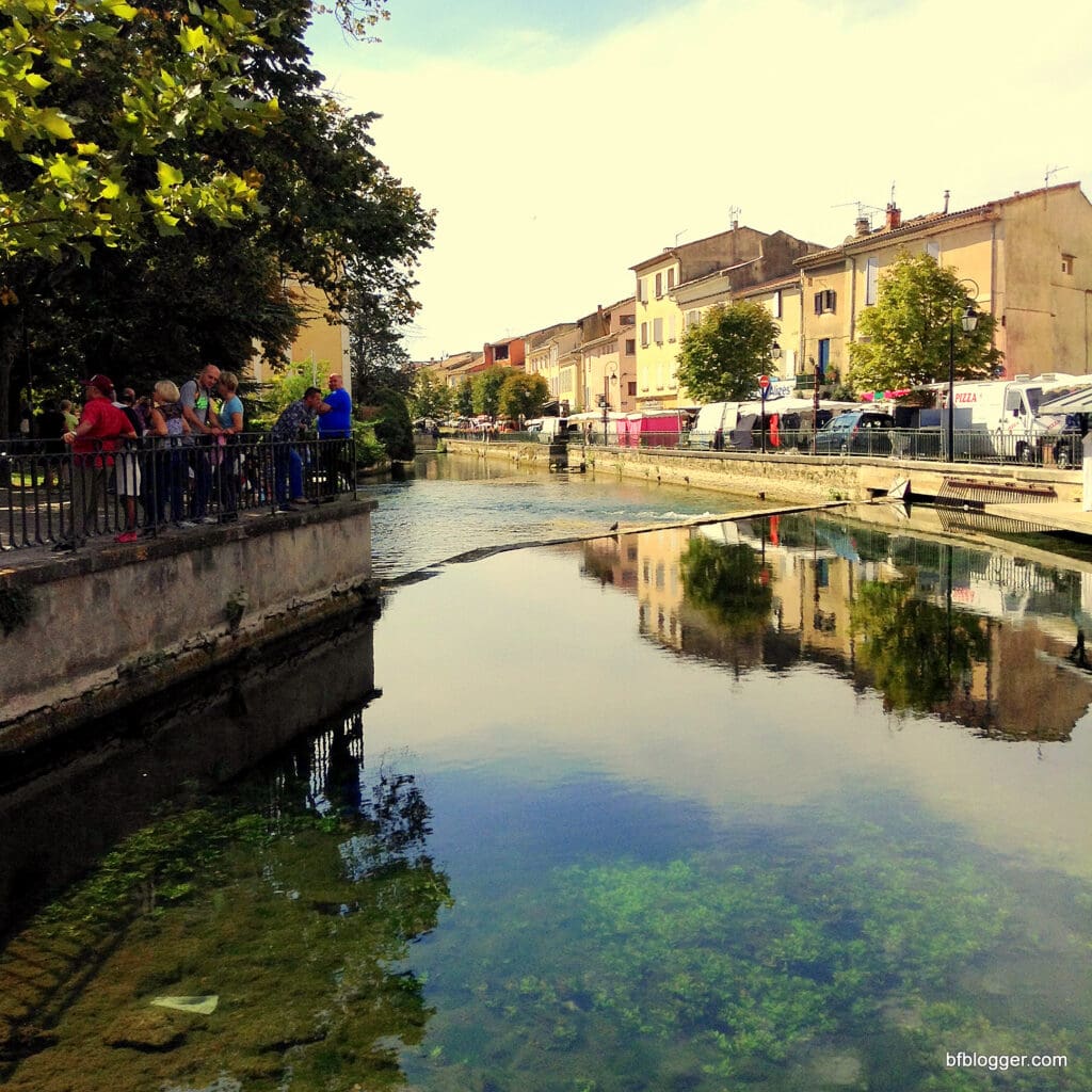 Canals snake through L'Isle Sur la Sorgue enhancing its charm