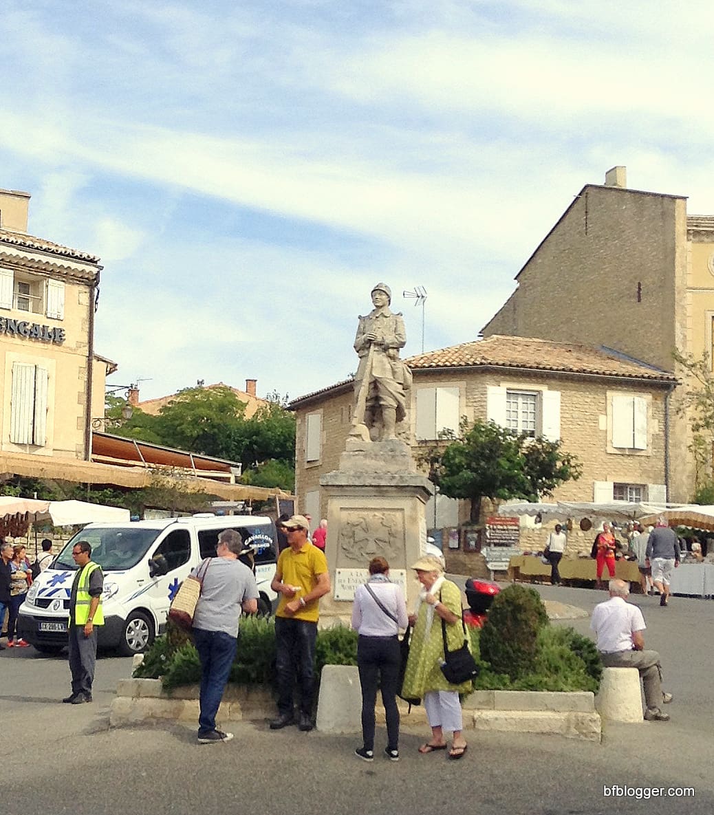 Village square in Gordes with WWII memorial