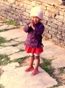 Himalayan child motioning "Namaste"