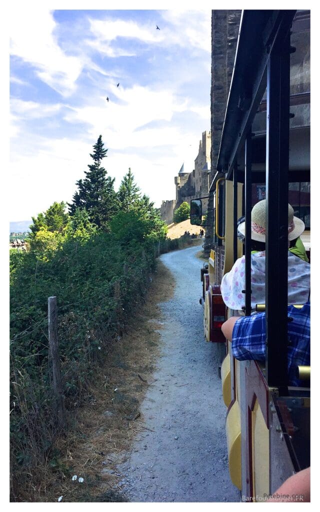 Train travels around the exterior of the city of Carcassonne