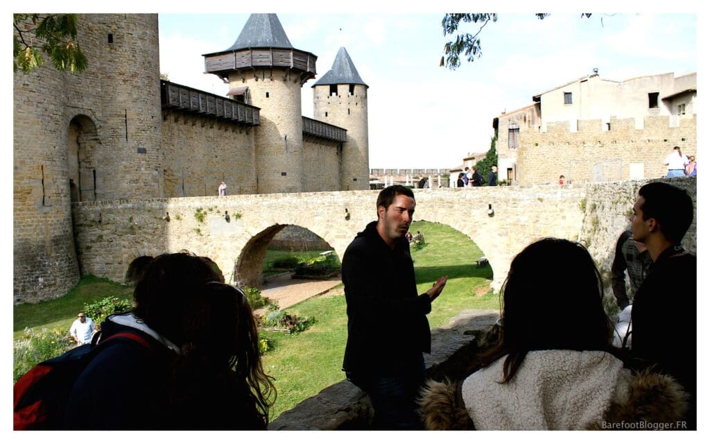 Tour guide at Carcassonne tells stories of advancing enemy troops and the rigor of the fortifications 