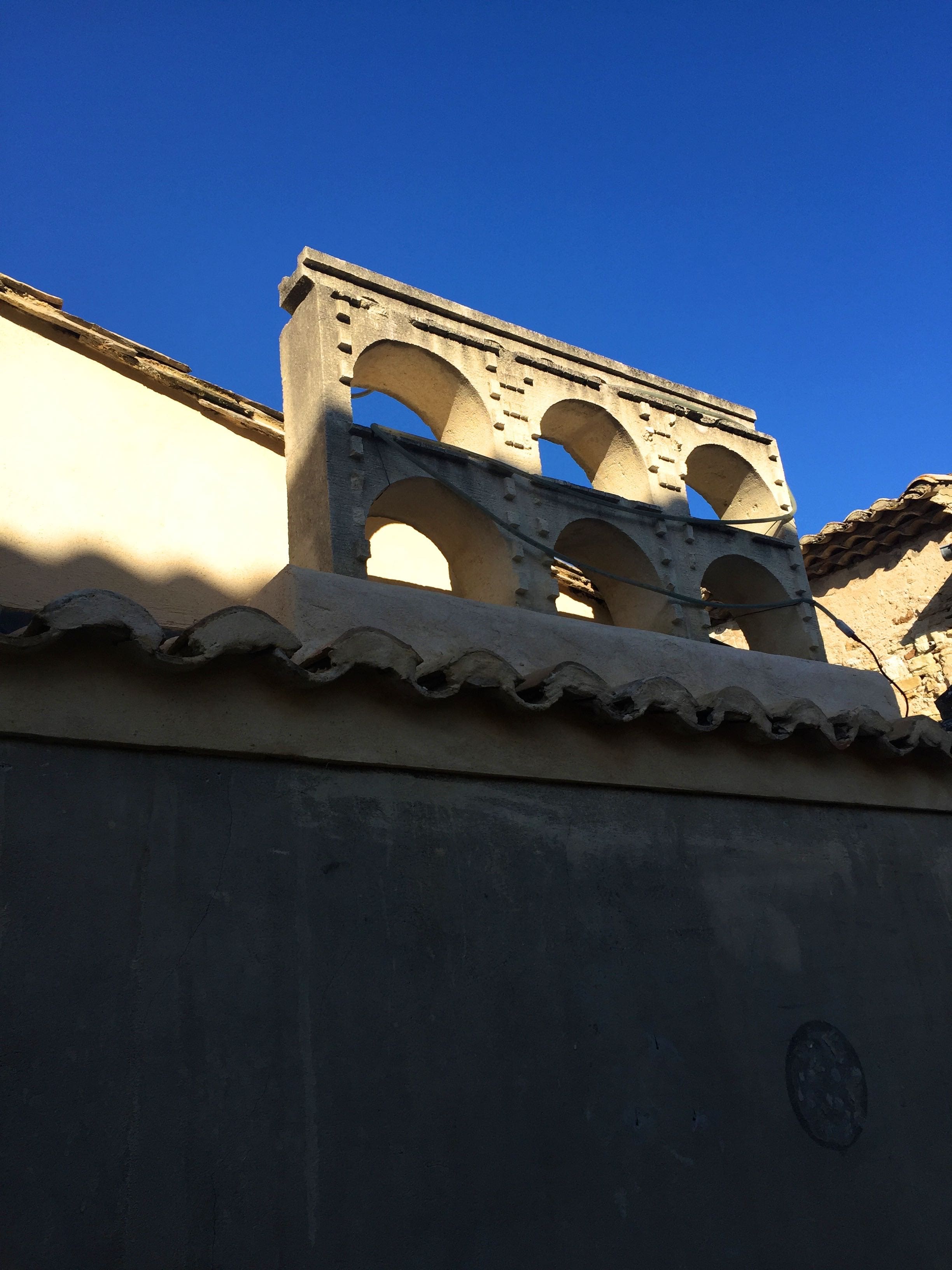 A model of Pont-du-Gard mounted on the roof of the shop