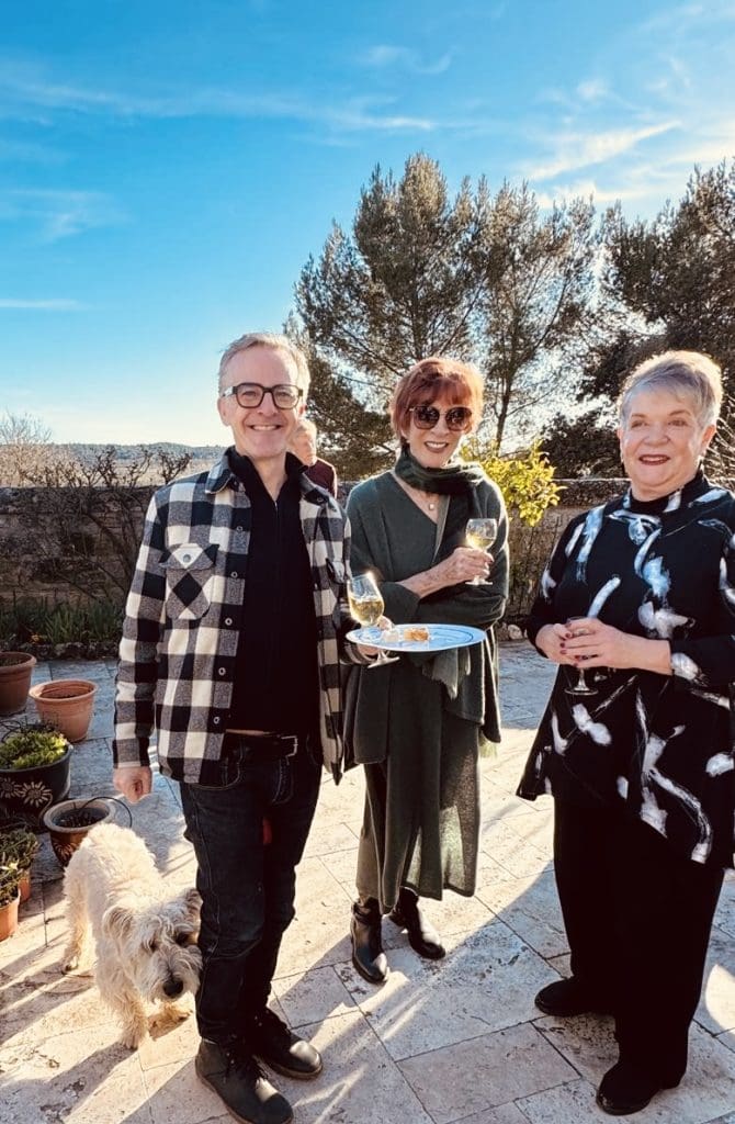 Friends celebrating on a terrace outside Uzès France